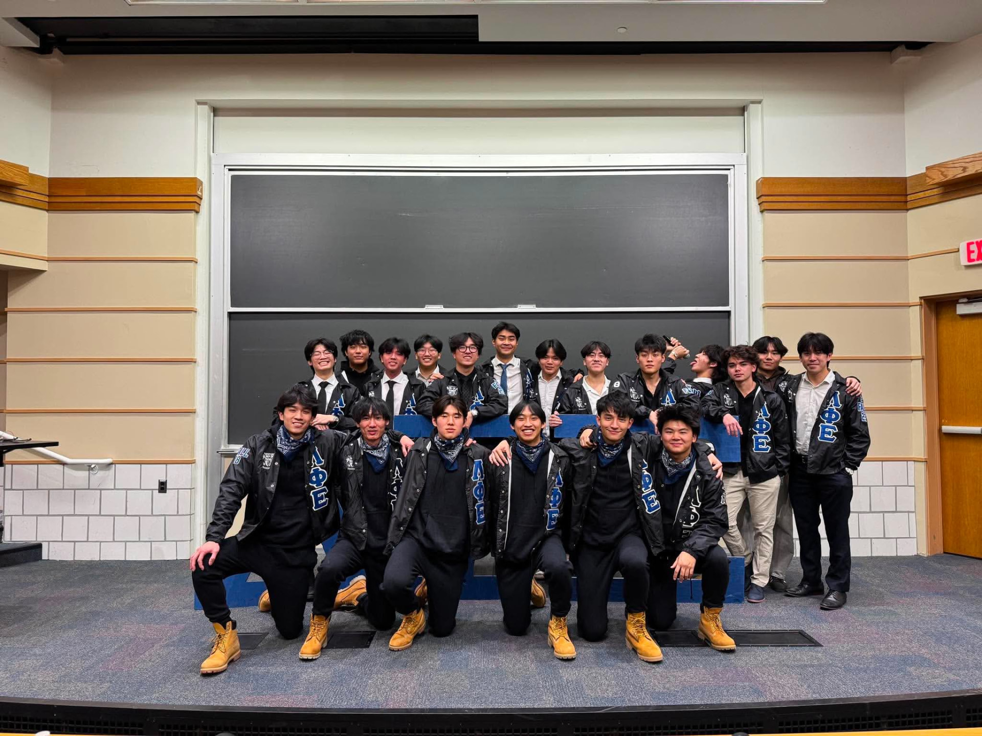 Xi Chapter members wearing Lambda Phi Epsilon chapter apparel at a University of Michigan gathering.
